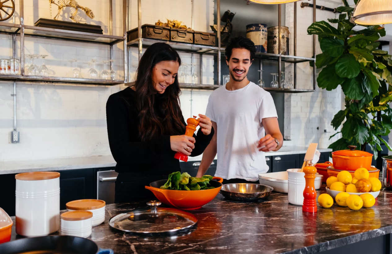 two people preparing food